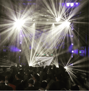 Concert lighting design with stage rigging, LED effects, and DJ AV setup for live music event."